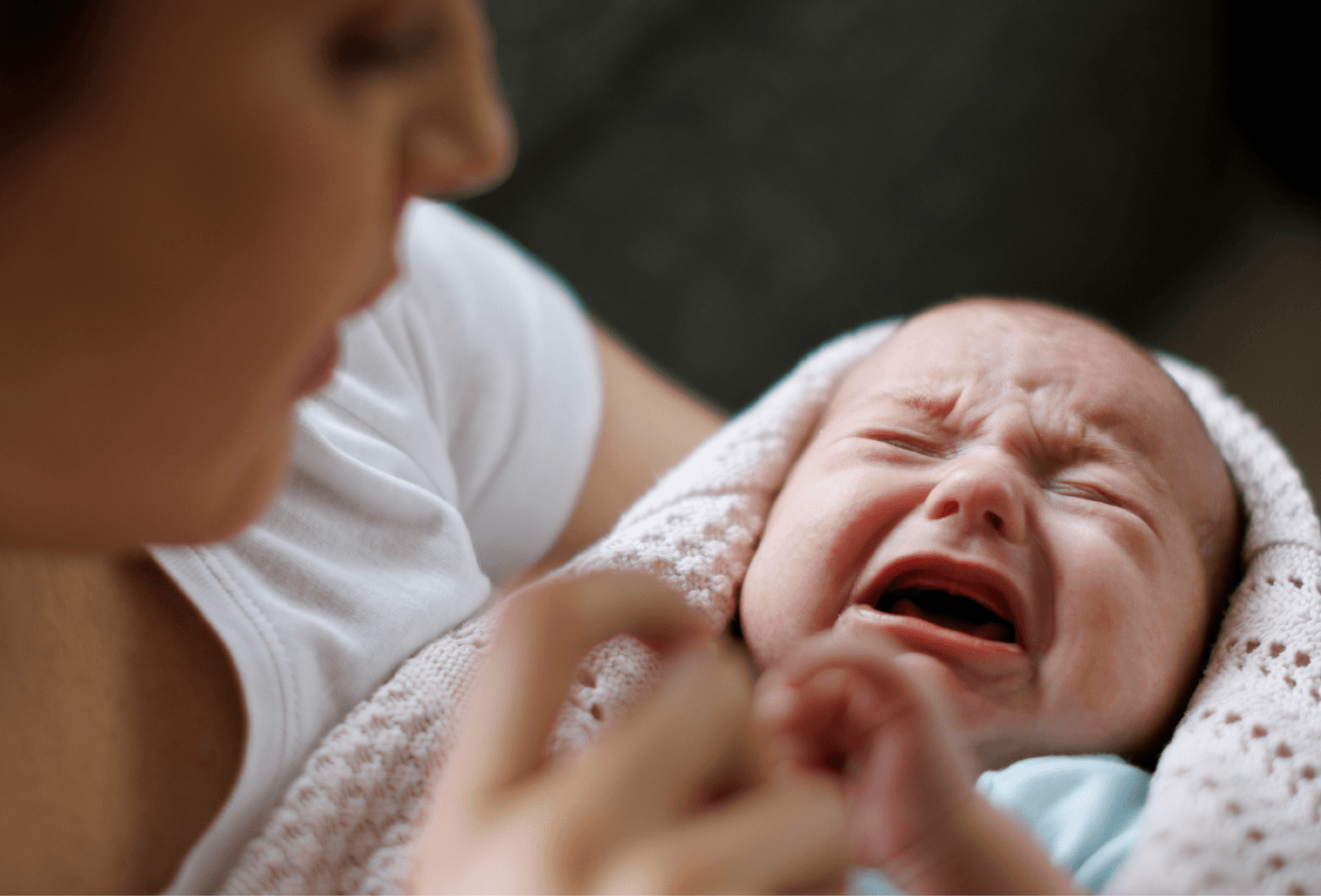 mother holding baby whilst they cry