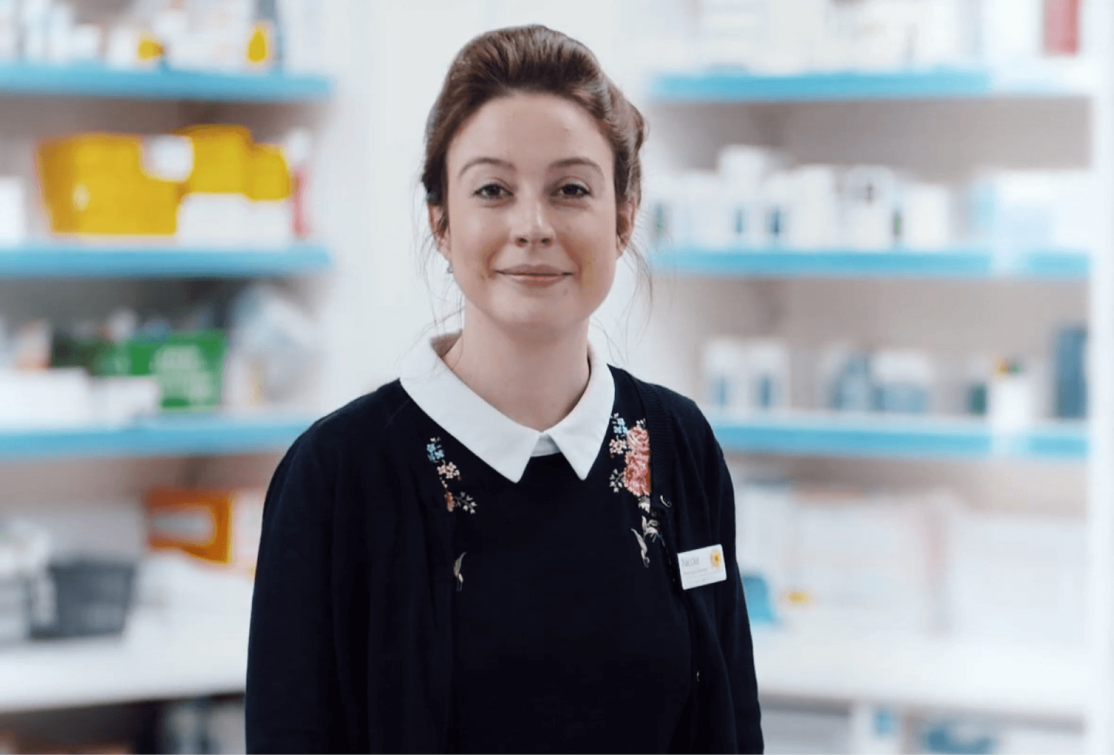 young lady pharmacist smiling into camera
